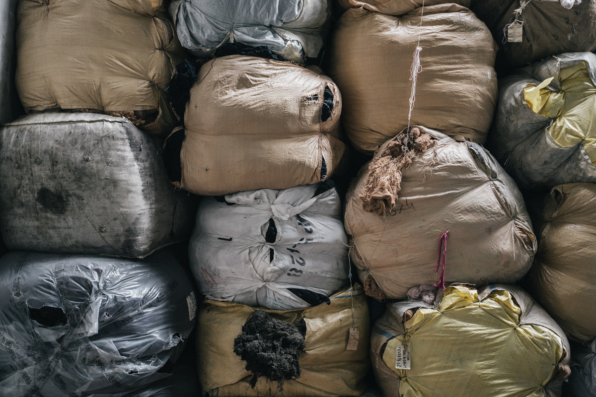 Bales of salvaged textiles sorted and waiting to be recycled